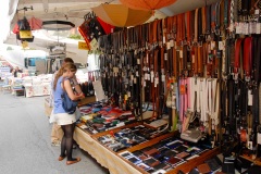 A vender stall displaying leather goods at the street market in Sachille, Italy