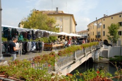 Vendors line the streets on Market Day in the Italian city of Sachille