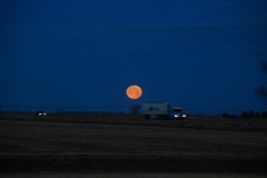 Full moon over an interstate