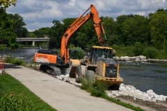 A track hoe and endloader place stone during the renovation of the Marge Cline Whitewater Course in Yorkville, IL