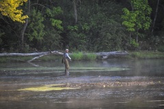 A fisherman casts in the morning light of the Fox River near Yorkville, IL