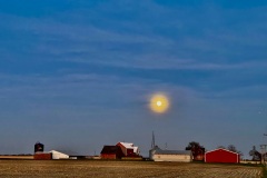 A full moon rises over a northern Illinois farm